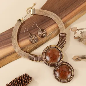Exquisite statement necklace and earrings set featuring bold geometric design with brown resin.