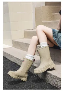 Casual solid color mid-calf rain boots for women, waterproof and slip-on design for outdoor use.