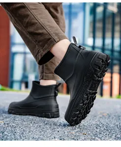 Close-up of waterproof men's short rain boots featuring non-slip rubber sole and traction.