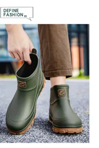 Close-up detail of waterproof men short rain boots with non-slip rubber sole for outdoor work.