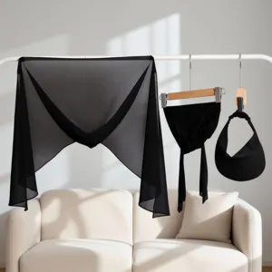 Detailed view of the black chiffon 3-piece accessory set hanging neatly on rack for women.