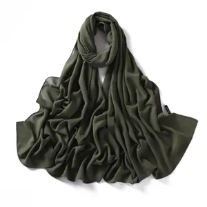 Close-up view of dark green chiffon scarf showing delicate fabric texture and neat edge detailing.