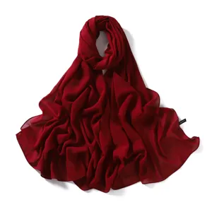 Wine red chiffon scarf detail showing lightweight sheer fabric texture and elegant drape.