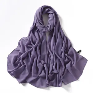 Detailed view of the purple chiffon scarf showing the delicate fabric texture and fine stitched edges.