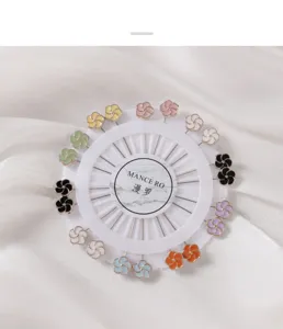 Detailed view of colorful flower-shaped decorative pins neatly arranged on white display card.