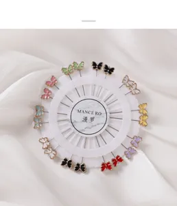 Colorful butterfly shaped straight pins set on white display wheel for sewing and decoration