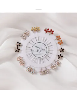 Set of colorful flower brooch pins on a round white display card for elegant clothing decor.