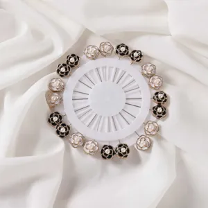 Detailed shot of camellia floral pearl head pins, decorative brooch pins for clothing fixing.