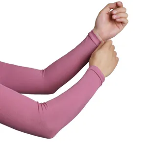 Detail view of pink ribbed sun protection arm sleeves showing elastic knit texture and fit.
