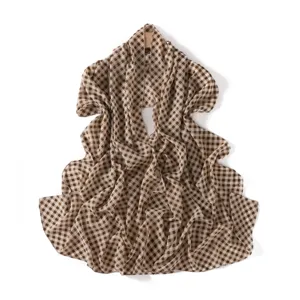 Brown and white gingham plaid pattern chiffon fabric detail view, lightweight and breathable material.