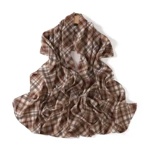 Detailed view of the elegant brown plaid chiffon scarf, showcasing soft texture and drape.