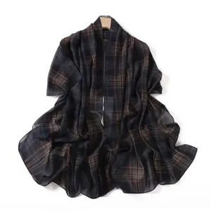 Detailed view of the elegant plaid chiffon scarf, featuring soft lightweight fabric texture.