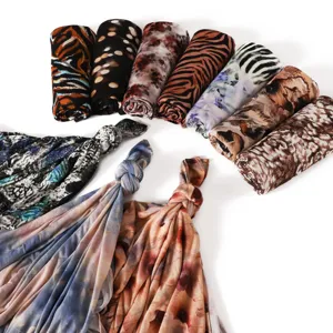 Detailed view of high elasticity printed animal pattern long scarf with soft comfortable fabric.