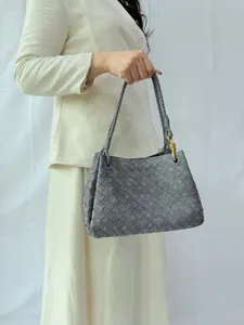 Grey suede woven shoulder bag for women, vintage large capacity handbag with metal knot.