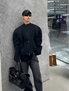 Black leather multi-pocket tote bag stylish commuter handbag for women daily chic wear.