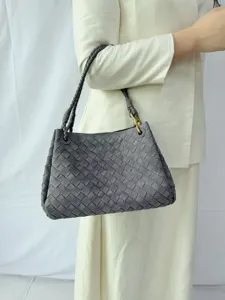 Grey woven suede shoulder bag detail, vintage retro handbag with braided handle for women.