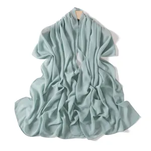 Mint green chiffon scarf detail, lightweight solid color shawl, elegant summer fashion accessory.