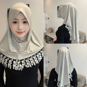 Elegant solid color crystal linen hijab with delicate lace fringe, comfortable head cover style.