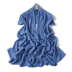 Lightweight blue chiffon scarf detail showing soft draped texture and elegant summer style.