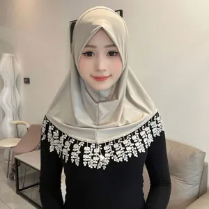 Detail view of solid crystal linen hijab with wheat wave lace tassel fringe for women.