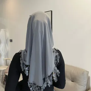 Detailed view of the elegant grey lace tassel headscarf, showing exquisite fringe craftsmanship.
