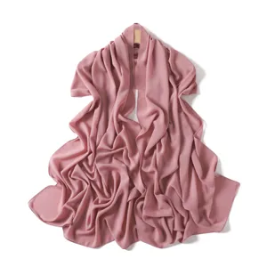 Detailed view showcasing the soft texture and drape of a dusty pink chiffon long scarf.