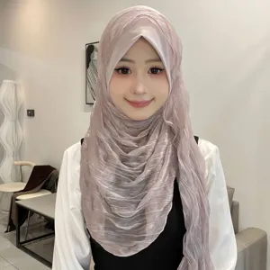 Detail shot of the crinkled solid color hijab headscarf, soft brim and comfortable wrap design.