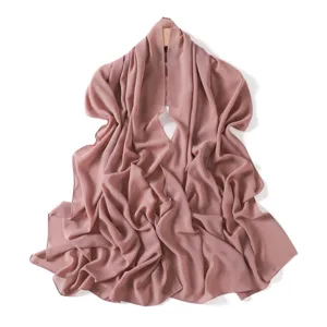 Detail view of a solid mauve pearl chiffon long scarf, lightweight and elegant for casual wear.