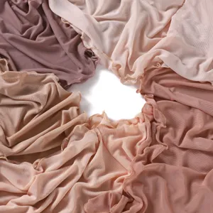 Detail shot of elastic mesh long scarves in various nude and pink shades, lightweight fabric.