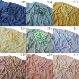 Ensemble deux pièces hijab en mousseline et bonnets noués en modal coloris variés.