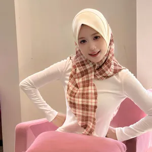 Detailed view of the sweet college style plaid mesh pleated triangle headscarf for autumn.