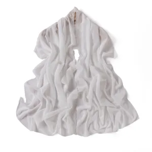 Detailed view of white chiffon scarf featuring delicate floral embroidery edges and soft drape.