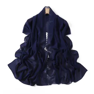 Floral embroidered chiffon scarf detail showing exquisite edge stitching and sheer texture.