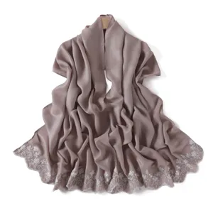 Detailed view of the elegant dusty purple scarf featuring delicate white floral embroidery.