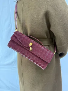 Burgundy woven leather shoulder bag chic vintage baguette clutch with knot hardware details