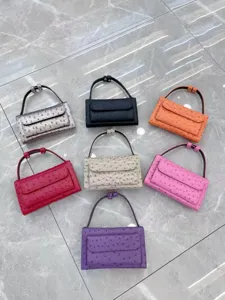 Details of colorful ostrich pattern baguette shoulder bag with flap and top handle for women.
