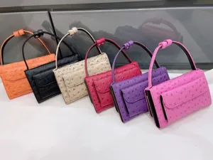 Close-up of colorful ostrich texture shoulder bags, multi-color flap baguette handbags.