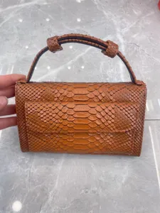 Brown snakeskin textured shoulder bag for women, chic flap crossbody and top handle bag.