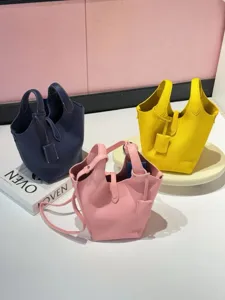 Classic genuine leather bucket bag, elegant top handle tote purse for women, large capacity.