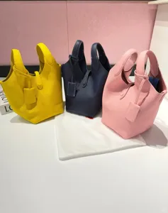 Genuine leather bucket bag with top handle, classic pebbled texture, large capacity daily tote.