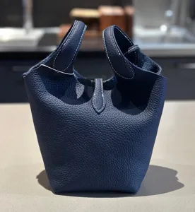 Dark blue top layer cowhide leather bucket bag, classic design handbag with double handles.