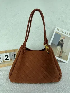 Brown suede woven shoulder bag detail, retro intrecciato design with elegant metal knot hardware.
