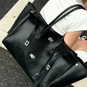 Black leather oversized tote bag commuter shoulder bag with multiple pockets stylish