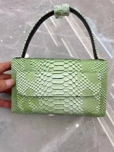 Green snakeskin pattern mini handbag, elegant flap shoulder bag for women daily fashion use.