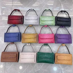 Colorful python pattern baguette shoulder bag for women, chic flap handbag with top handle.