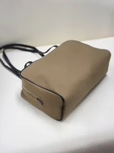 Minimalist canvas bowling bag with leather trim, large capacity shoulder bag for daily use.