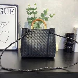 Black woven leather tote bag with metal wooden handle and crossbody strap for women daily use