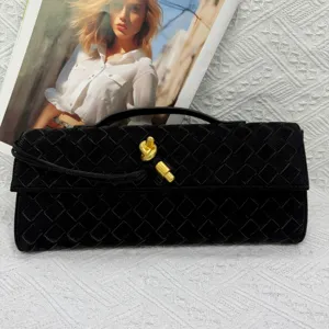 Elegant black woven clutch bag with gold knot closure for women evening party vintage fashion.