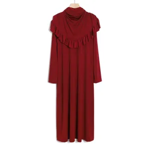 Back detail of dark red modest dress featuring pleated ruffles and long sleeves, elegant abaya design.
