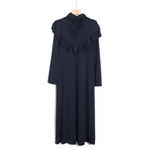 Detailed view of the elegant dark blue long-sleeve modest maxi dress with integrated capelet.